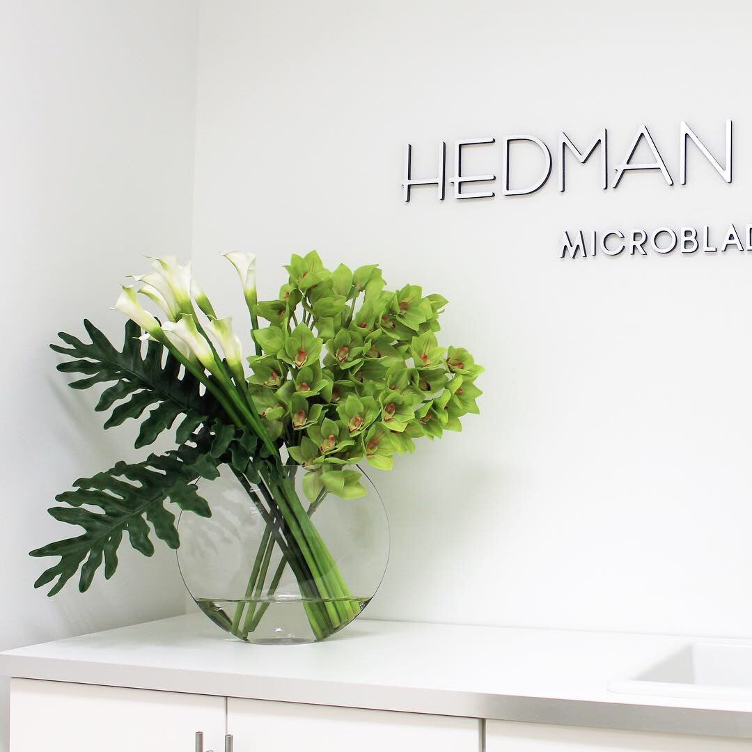 Premium Moon Vase with green Cymbidiums and Callas